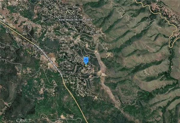 a aerial view of a house with a yard