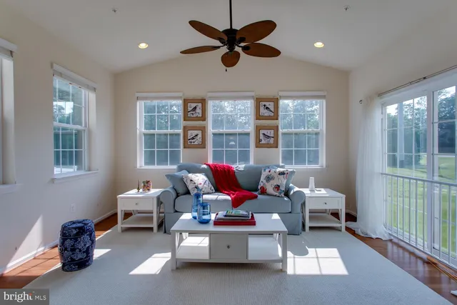 a living room with furniture and windows