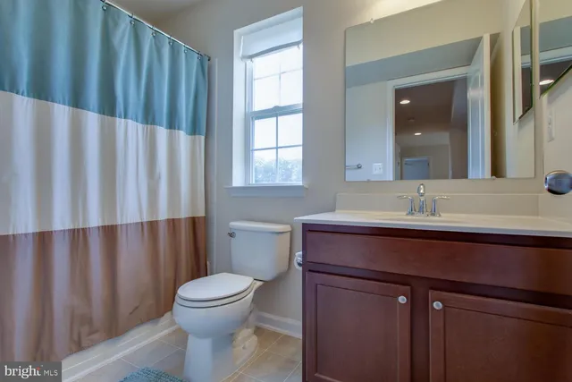 a bedroom with bed and a dresser