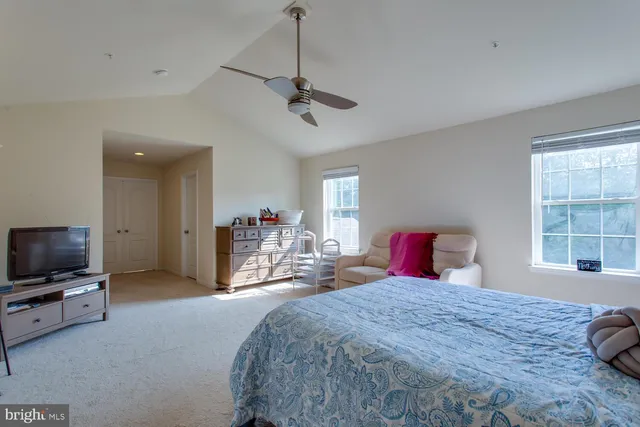 a spacious bathroom with a tub sink shower and mirror