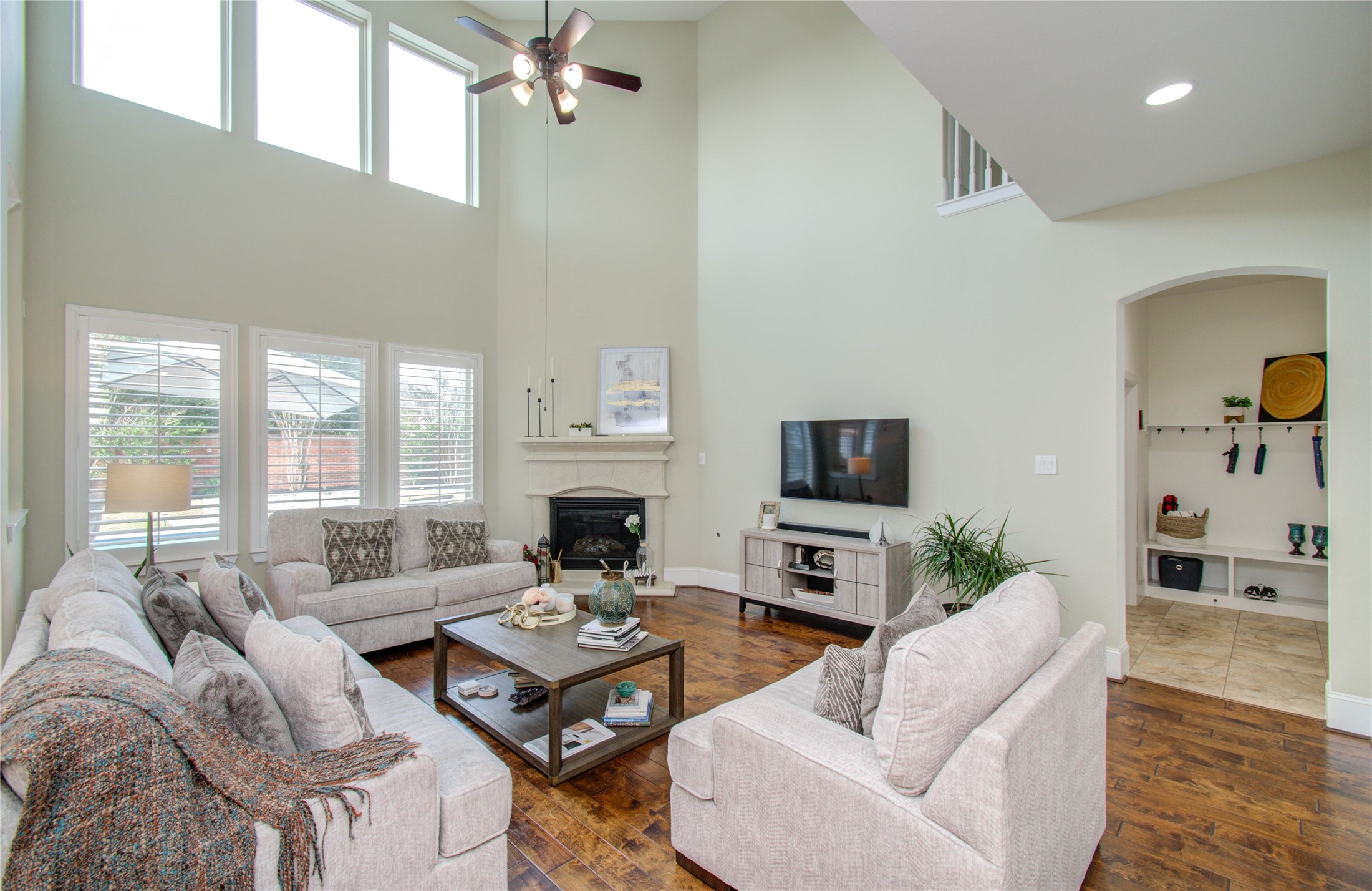 28627 Rolling Ridge Drive Katy, TX 77494 - Photo 14 of 44 a living room with furniture a fireplace and a flat screen tv