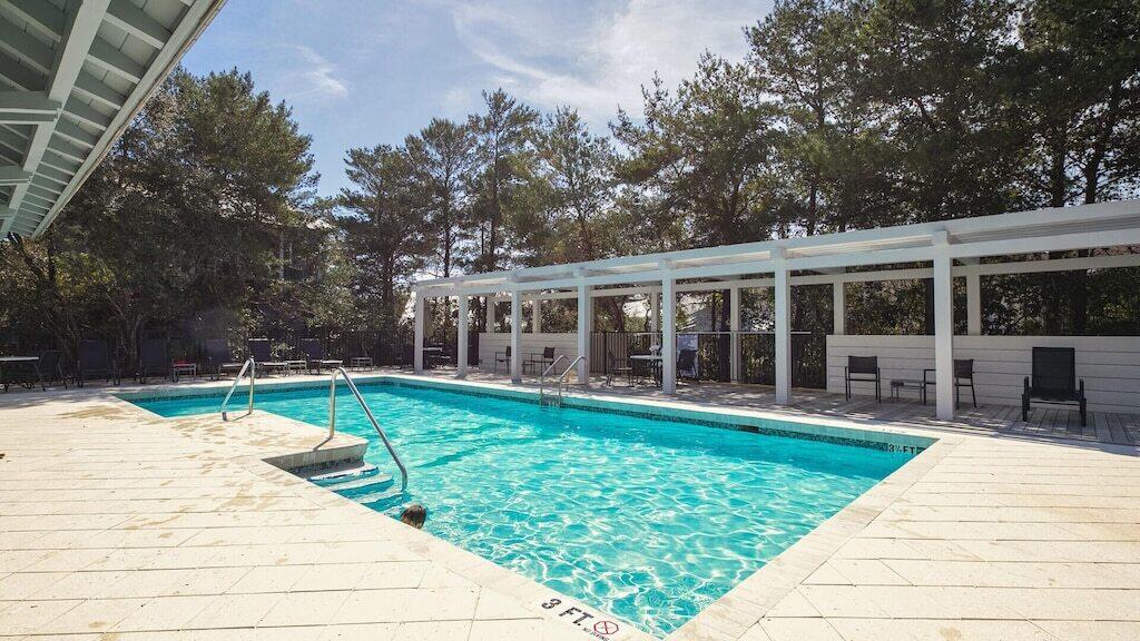 29 Olivia Lane Seacrest, FL 32461 - Photo 25 of 28 a view of a house with backyard sitting area and garden