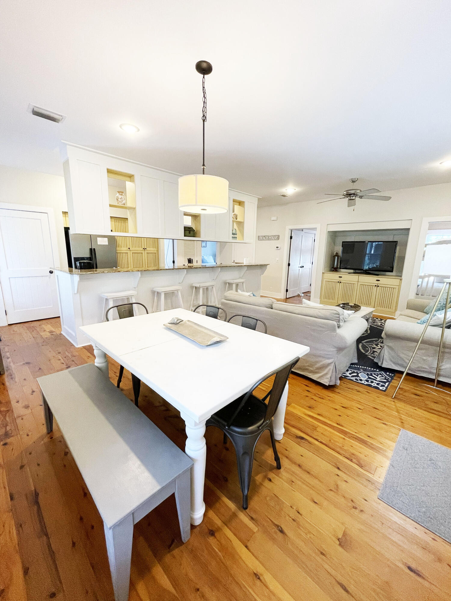 29 Olivia Lane Seacrest, FL 32461 - Photo 7 of 28 a view of a dining room with furniture and wooden floor