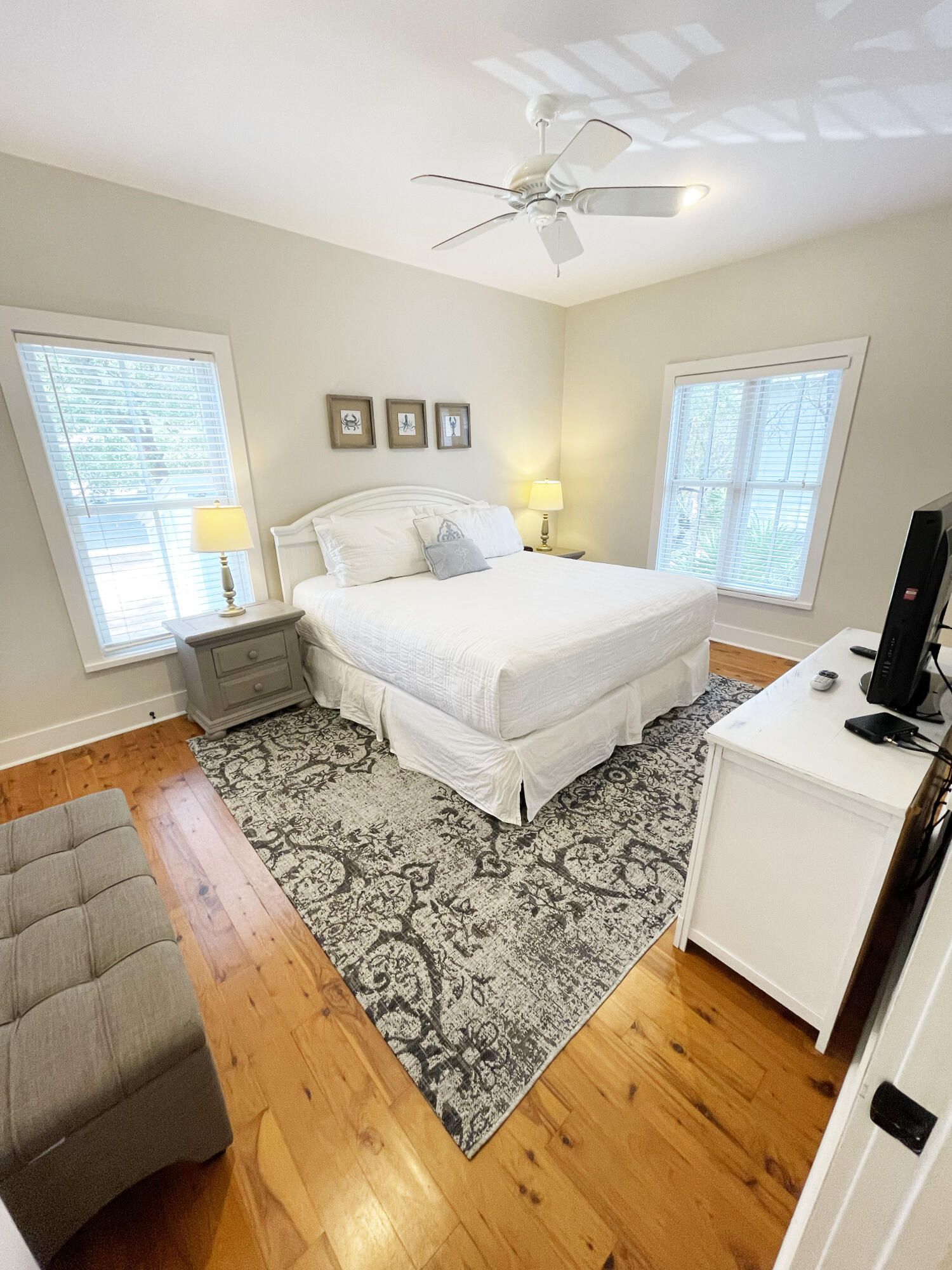 29 Olivia Lane Seacrest, FL 32461 - Photo 9 of 28 a bedroom with a bed and wooden floor