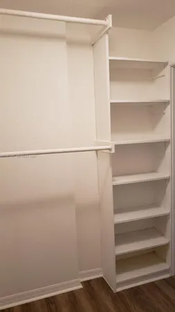 a view of a room with racks on the wall