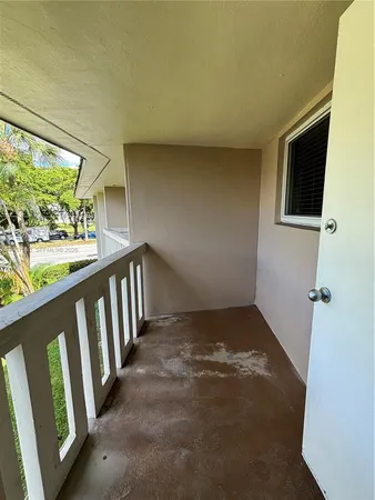 a swimming pool view with a seating space