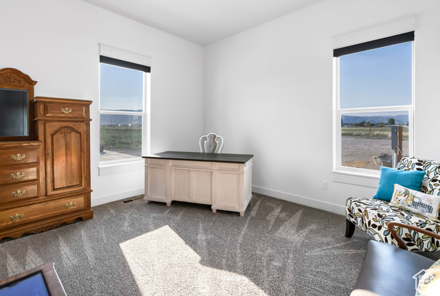 1952 Highway 118 Monroe, UT 84754 - Photo 43 of 88 Living area featuring dark carpet and baseboards