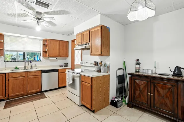 a kitchen with a stove and a sink
