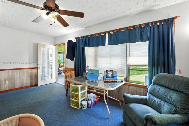 a bedroom with bed and window