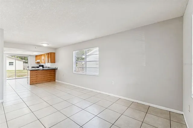 a view of kitchen with microwave oven and cabinets