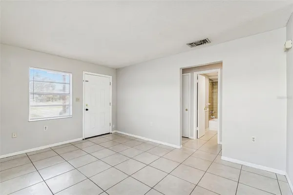 a view of an empty room and window