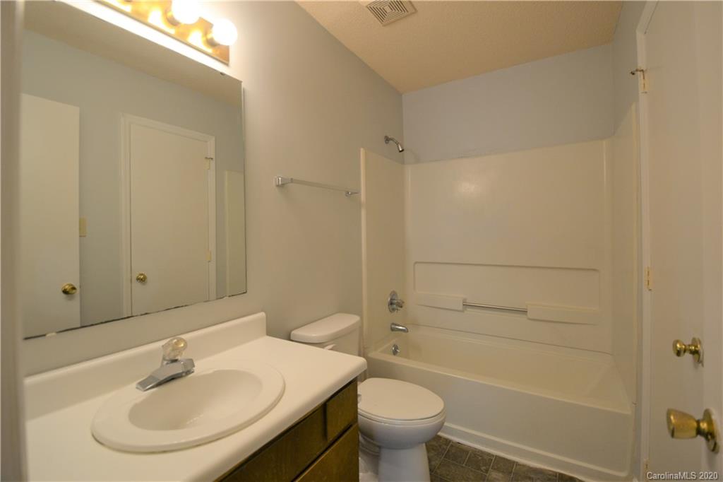 2343 Roland Drive, Unit F Monroe, NC 28110 - Photo 12 of 14 a bathroom with a sink toilet and shower