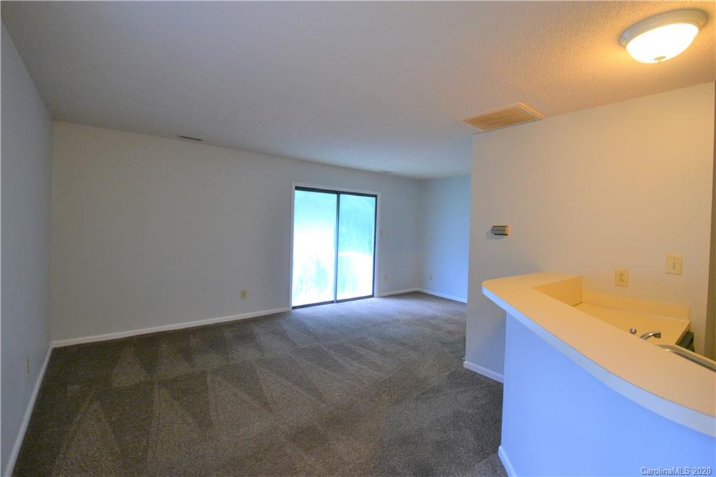 2343 Roland Drive, Unit F Monroe, NC 28110 - Photo 7 of 14 a view of an empty room with a window
