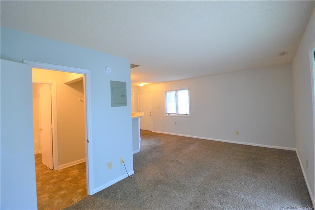 2343 Roland Drive, Unit F Monroe, NC 28110 - Photo 9 of 14 an empty room with windows