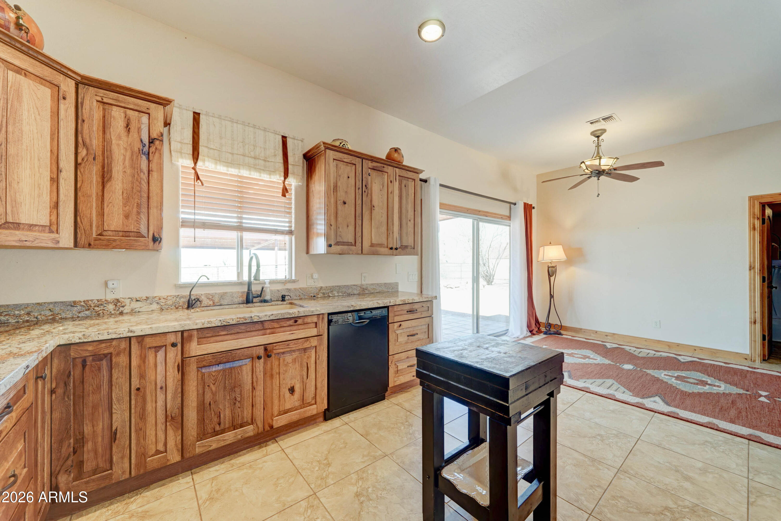 4642 North Tomahawk Road Apache Junction, AZ 85119 - Photo 11 of 41 a kitchen with a stove a sink and a refrigerator