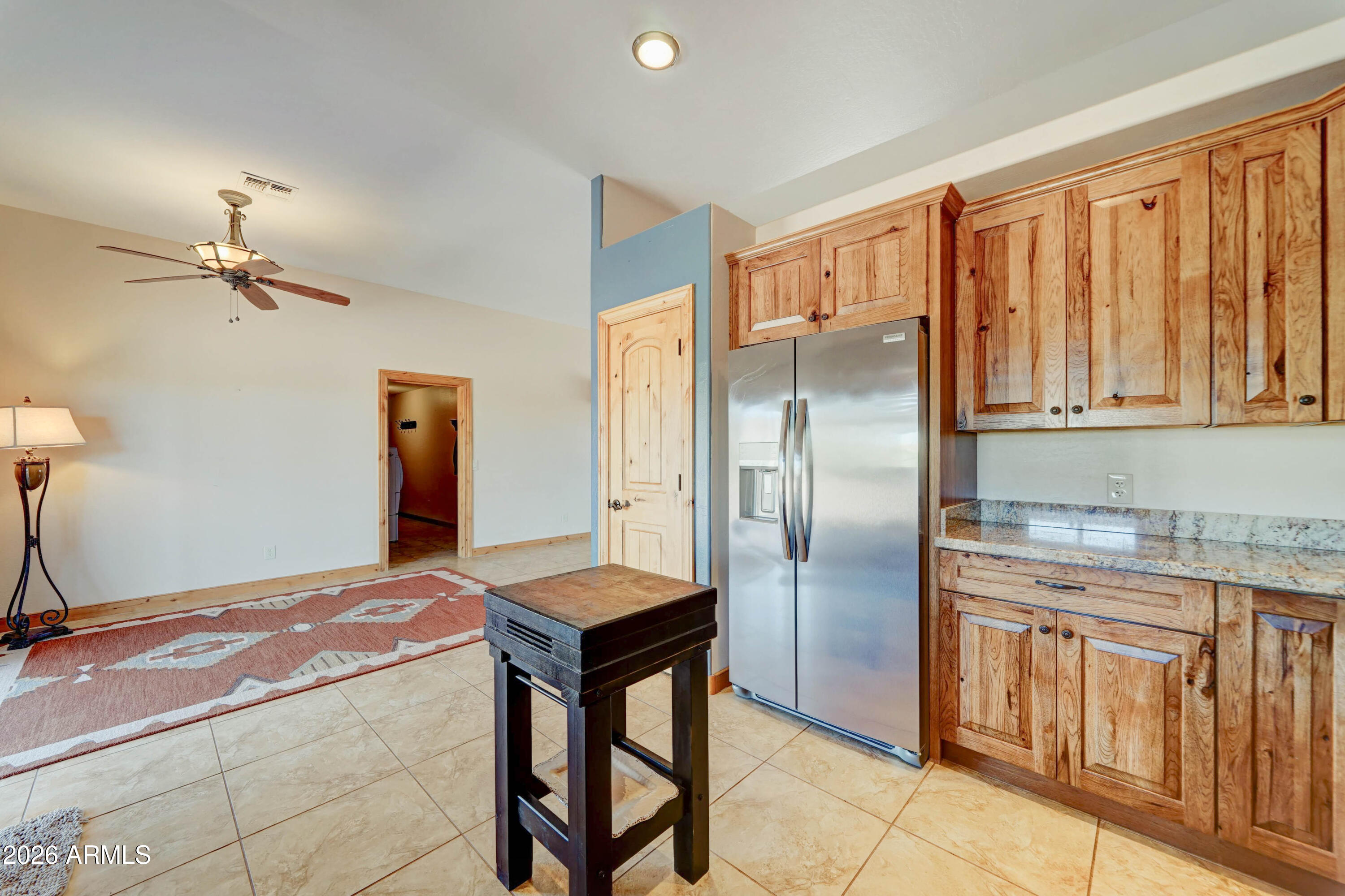 4642 North Tomahawk Road Apache Junction, AZ 85119 - Photo 12 of 41 a kitchen with stainless steel appliances granite countertop a refrigerator a stove and a sink