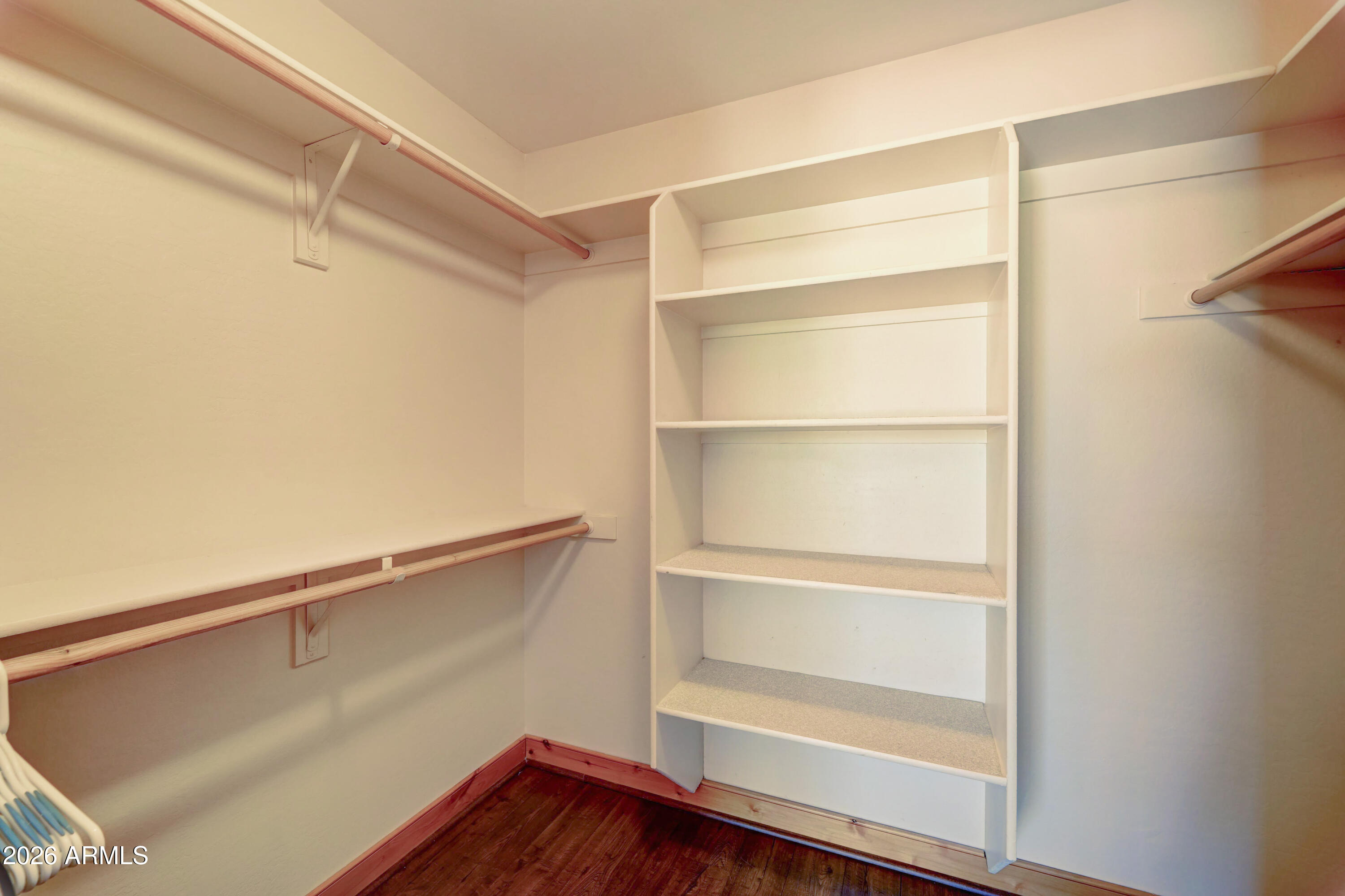 4642 North Tomahawk Road Apache Junction, AZ 85119 - Photo 18 of 41 a view of an empty walk in closet