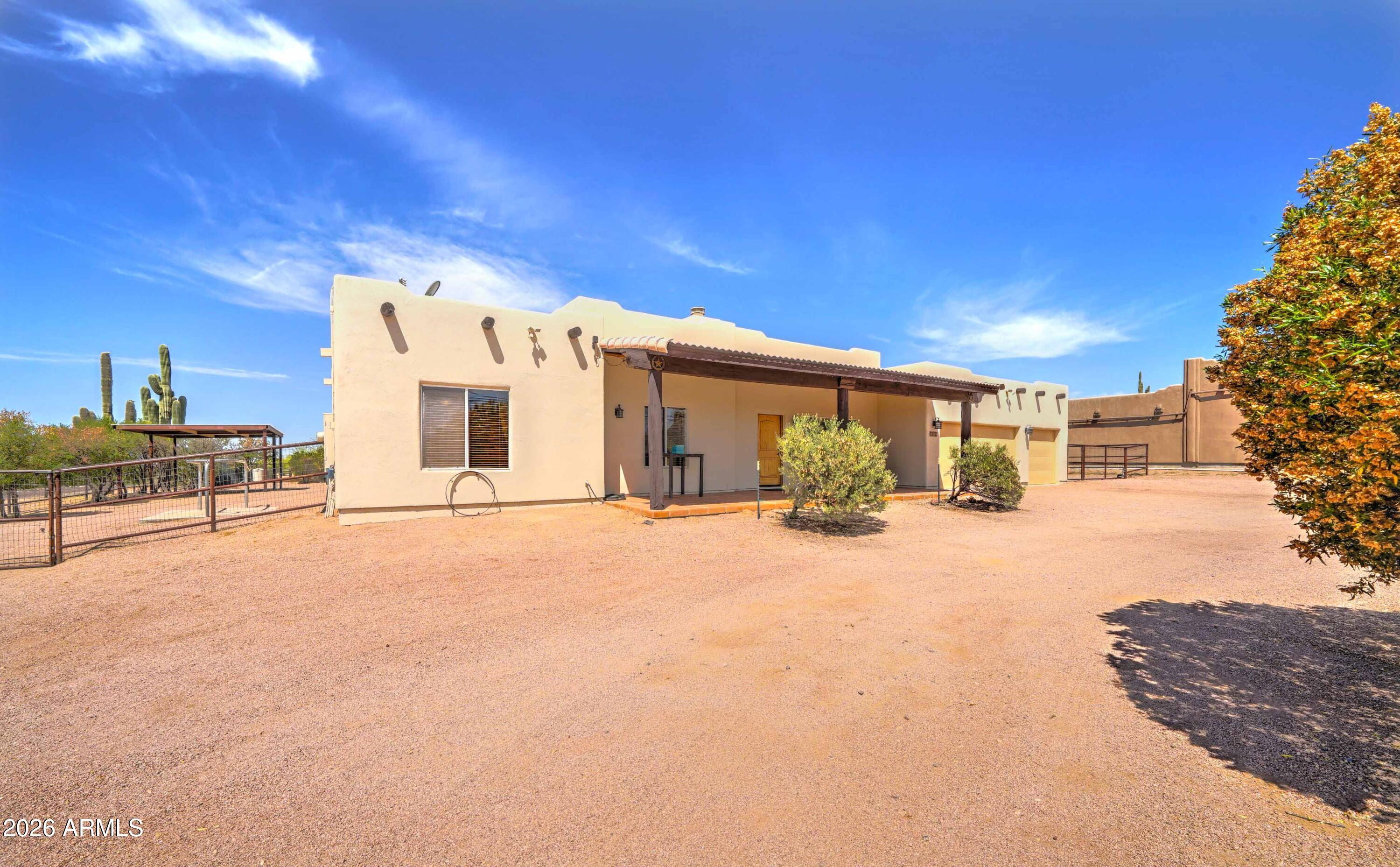 4642 North Tomahawk Road Apache Junction, AZ 85119 - Photo 4 of 41 a view of a house with a outdoor space