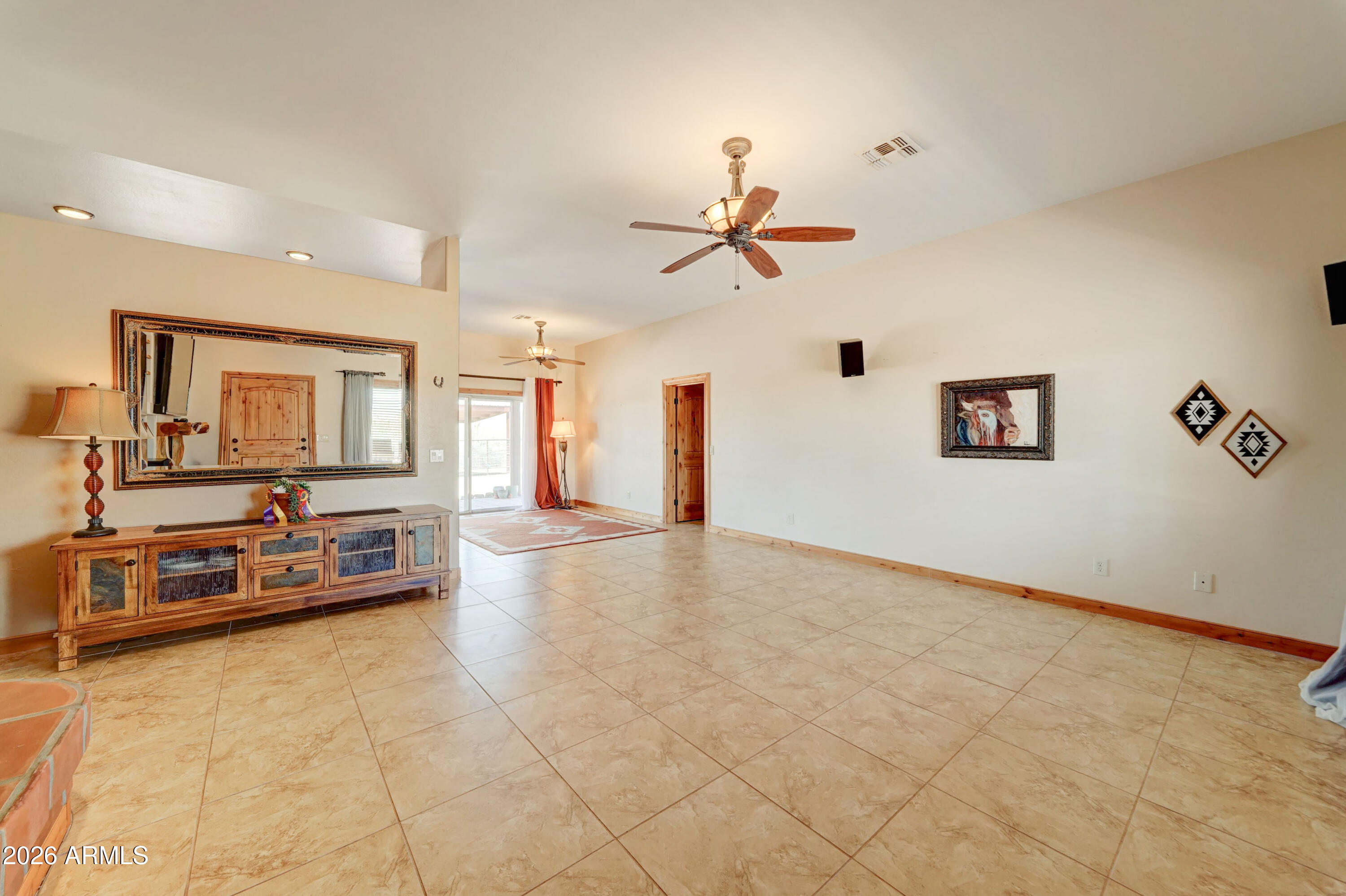 4642 North Tomahawk Road Apache Junction, AZ 85119 - Photo 5 of 41 a view of a livingroom with furniture and a ceiling fan