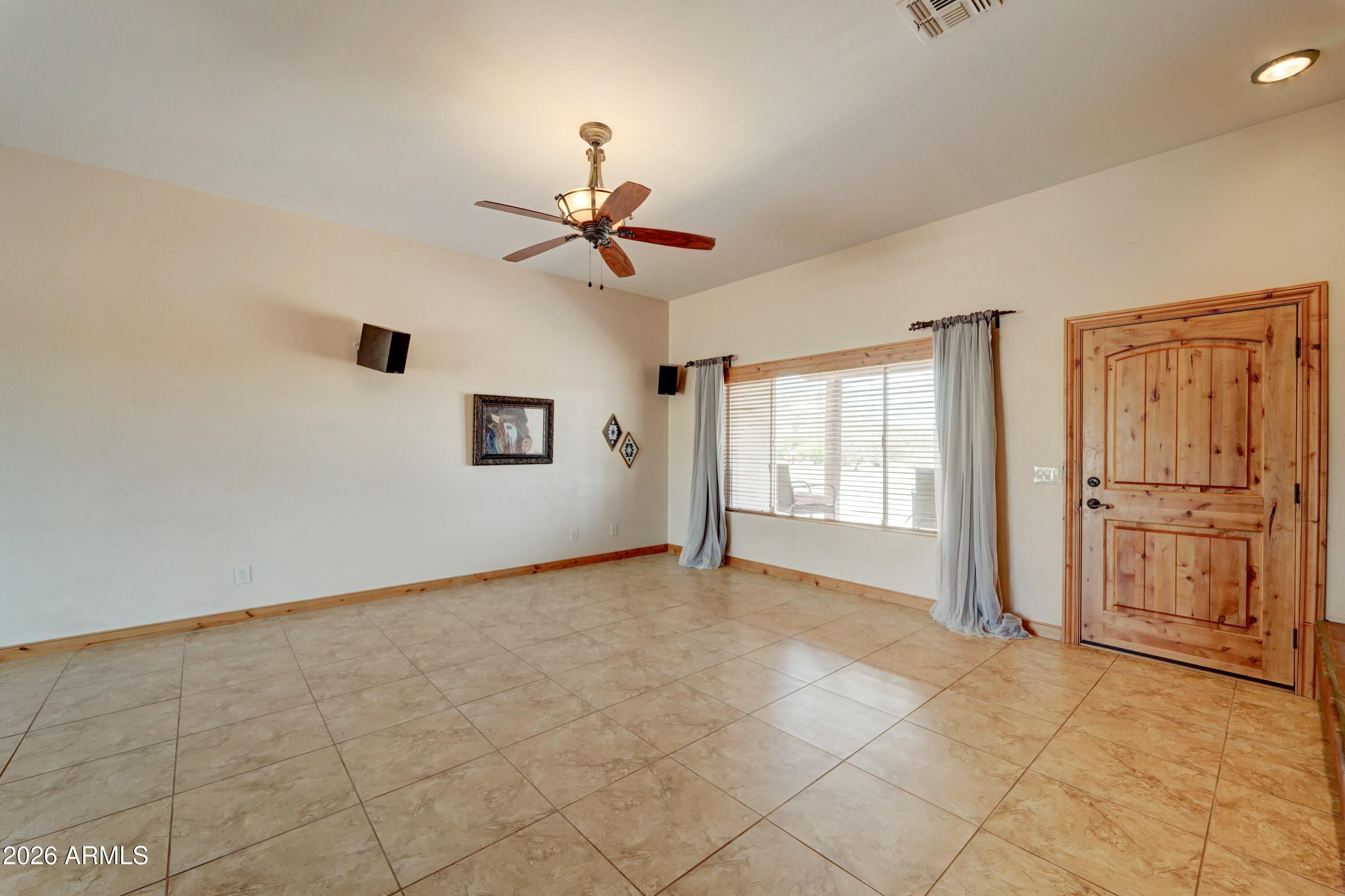 4642 North Tomahawk Road Apache Junction, AZ 85119 - Photo 6 of 41 a view of an empty room with a window