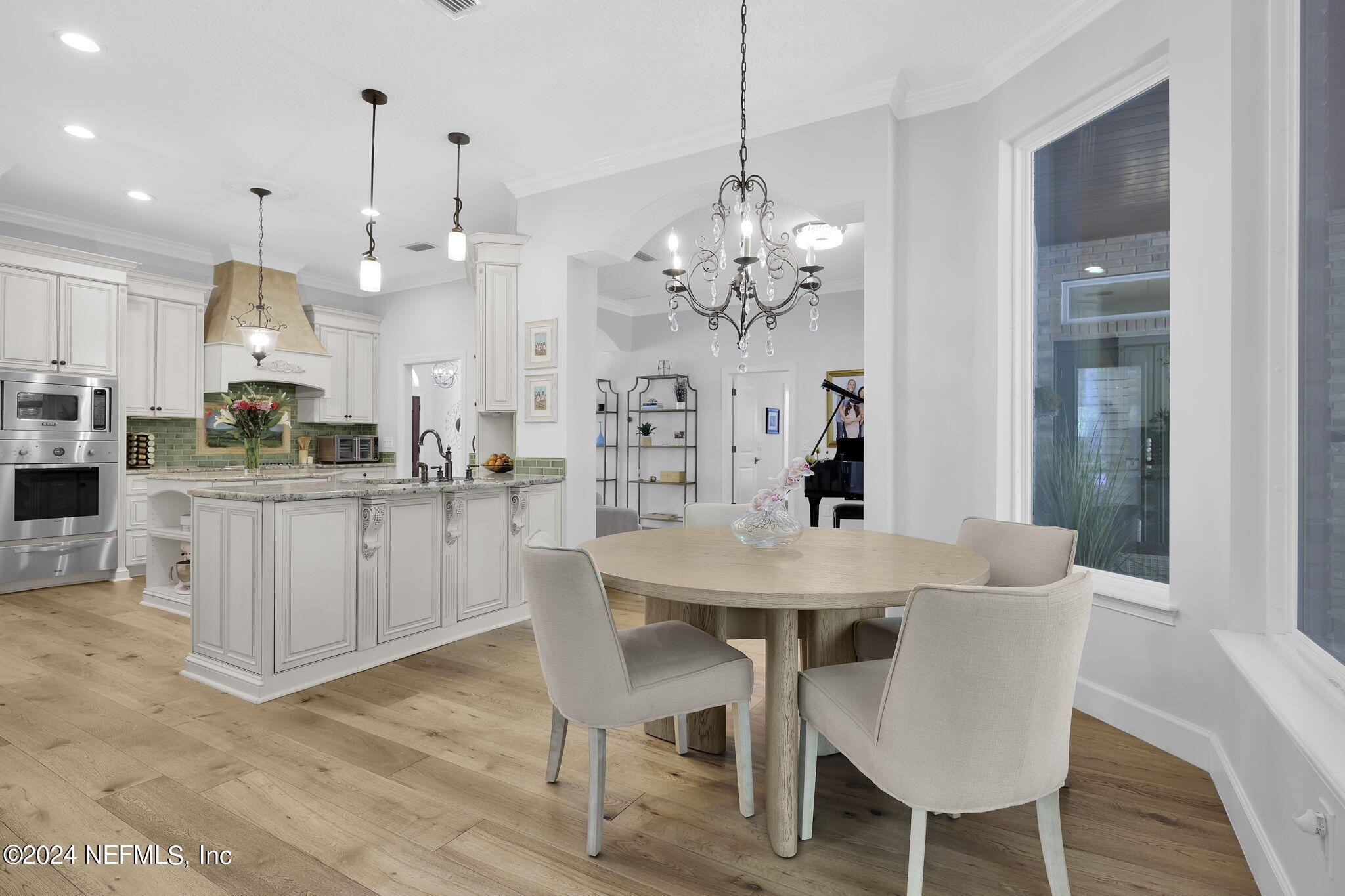 789 Mill Stream Road Ponte Vedra Beach, FL 32082 - Photo 12 of 46 a view of a dining room with furniture and wooden floor