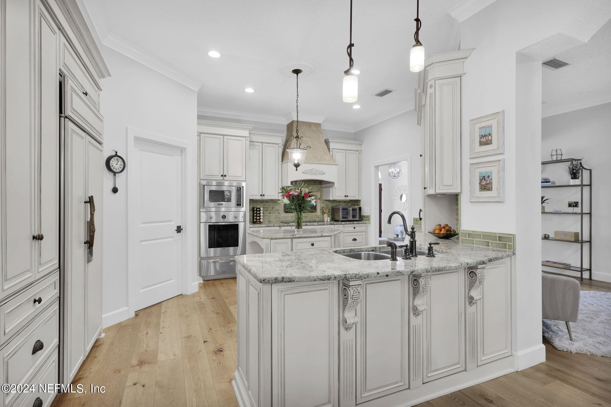 789 Mill Stream Road Ponte Vedra Beach, FL 32082 - Photo 13 of 46 a kitchen with kitchen island a sink stove and refrigerator