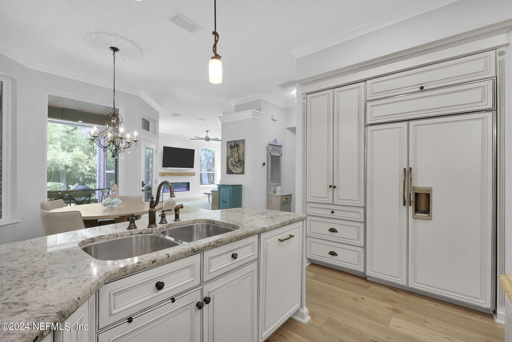 789 Mill Stream Road Ponte Vedra Beach, FL 32082 - Photo 16 of 46 a kitchen with stainless steel appliances granite countertop a sink a stove and a window