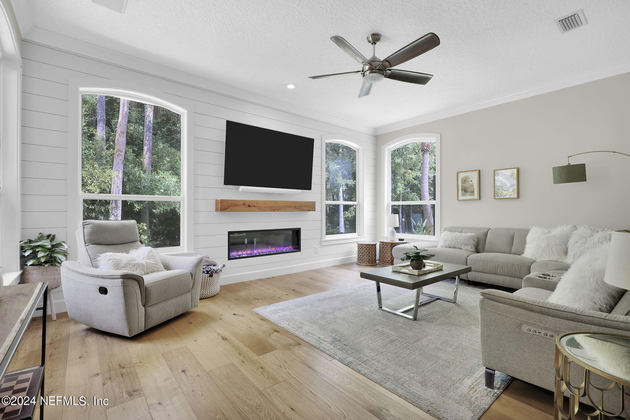 789 Mill Stream Road Ponte Vedra Beach, FL 32082 - Photo 17 of 46 a living room with furniture a fireplace and a flat screen tv