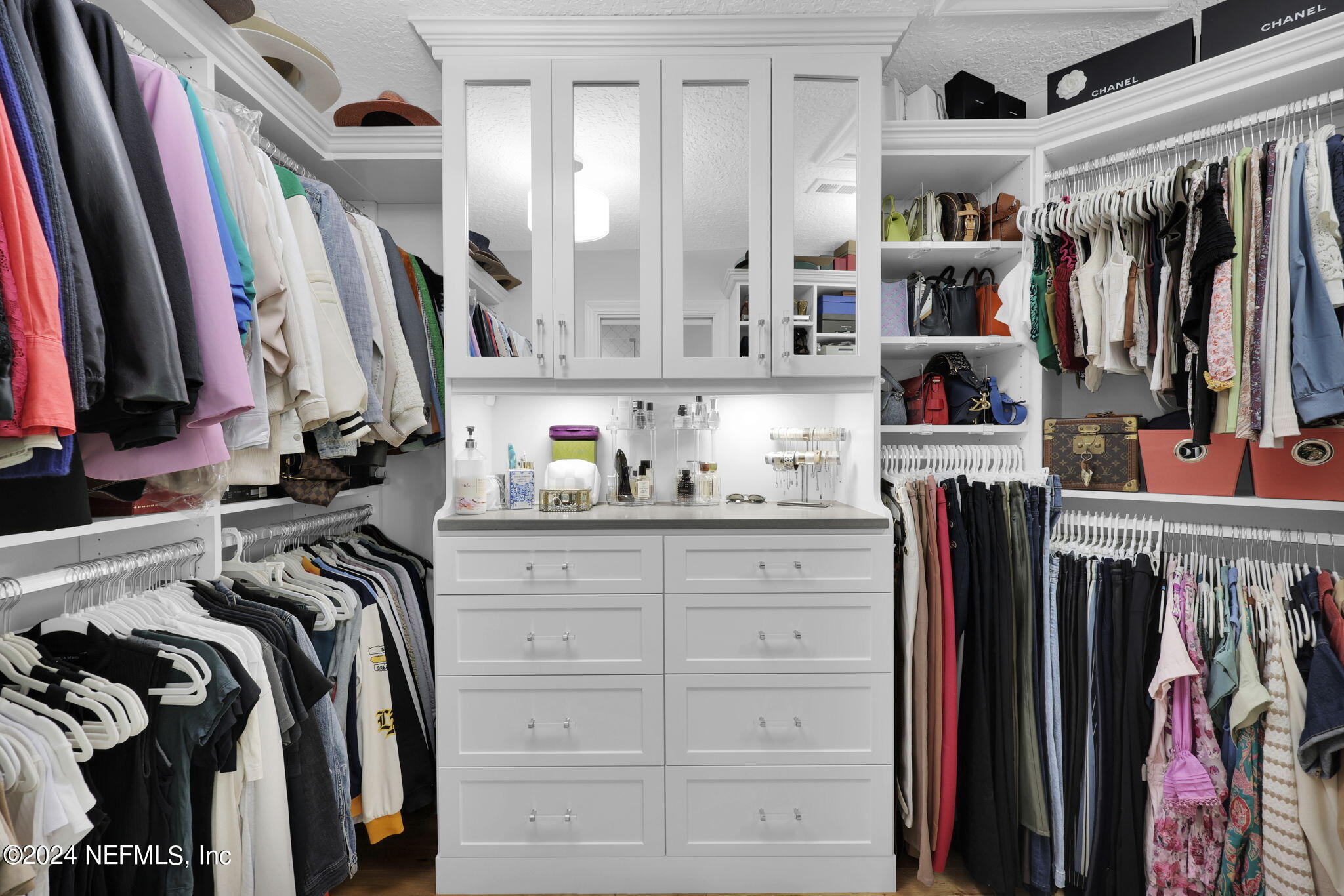 789 Mill Stream Road Ponte Vedra Beach, FL 32082 - Photo 24 of 46 a view of walk in closet with clothes and shoes