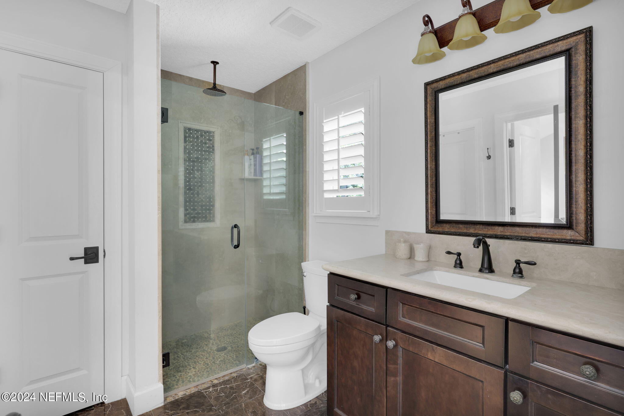 789 Mill Stream Road Ponte Vedra Beach, FL 32082 - Photo 25 of 46 a bathroom with a sink a toilet and shower