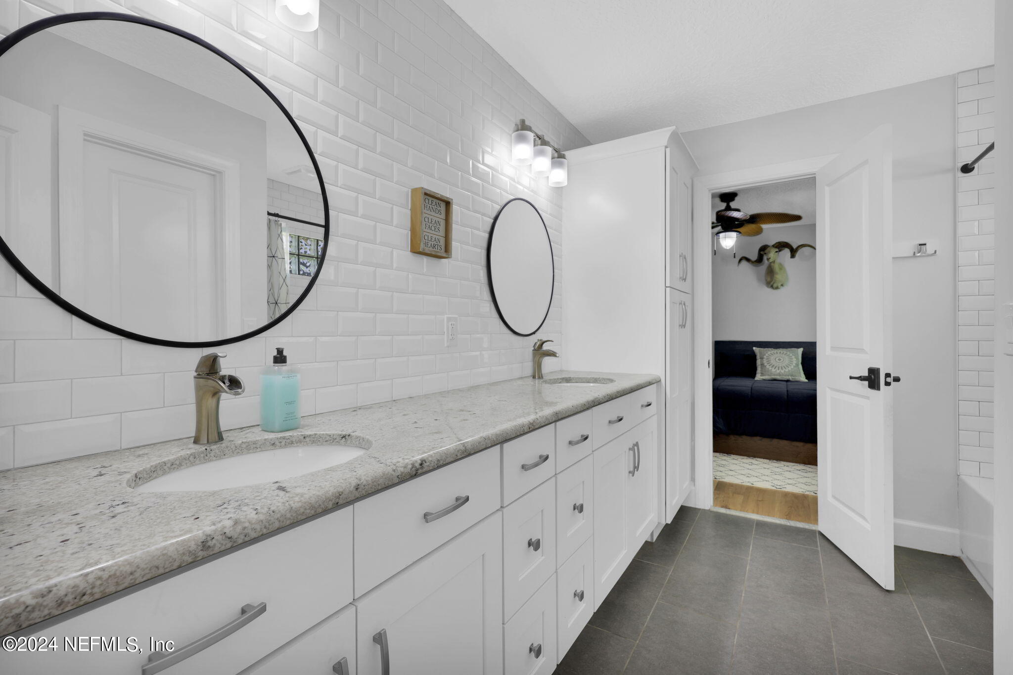 789 Mill Stream Road Ponte Vedra Beach, FL 32082 - Photo 27 of 46 a spacious bathroom with a double vanity sink and a mirror