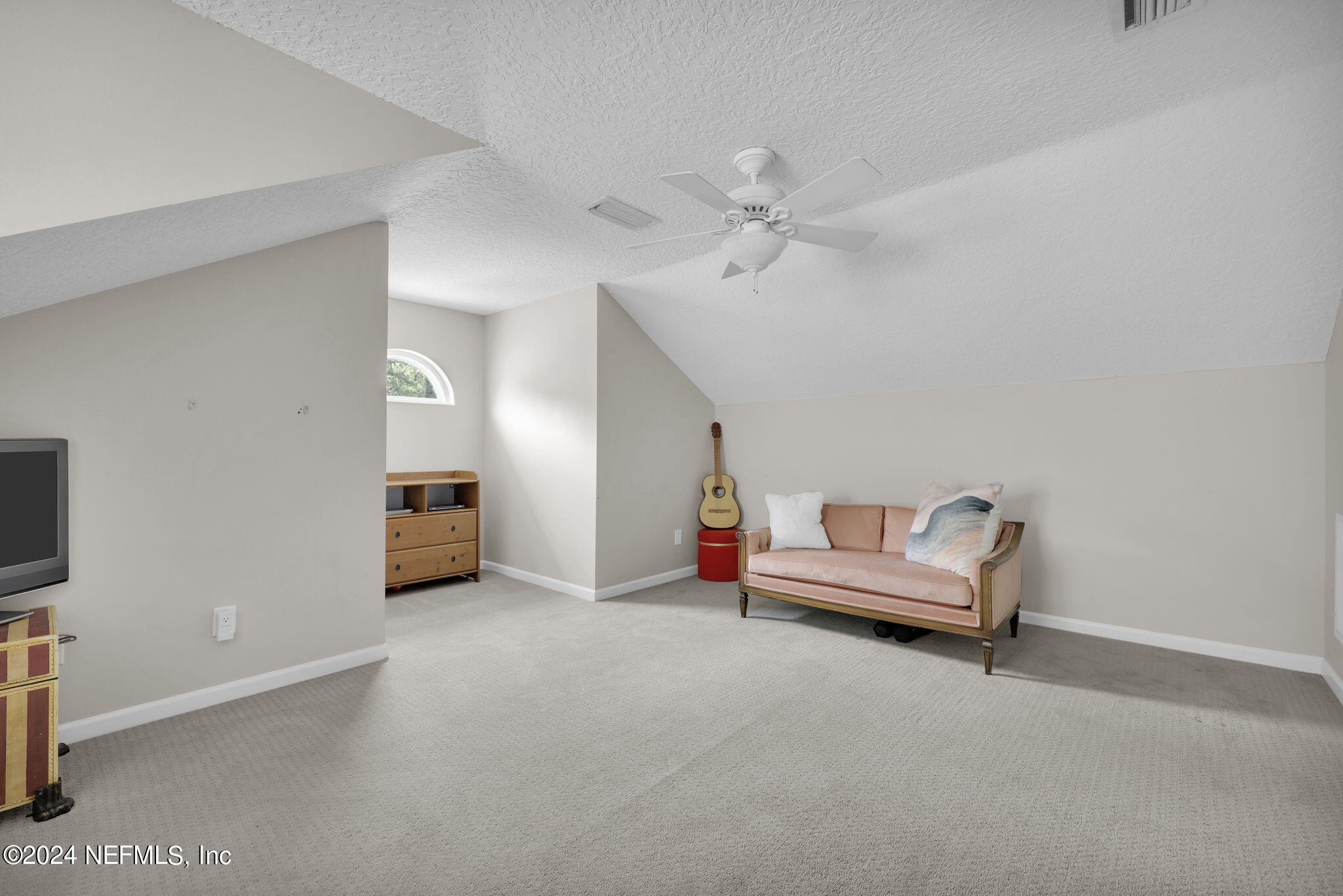 789 Mill Stream Road Ponte Vedra Beach, FL 32082 - Photo 31 of 46 a living room with furniture and a flat screen tv