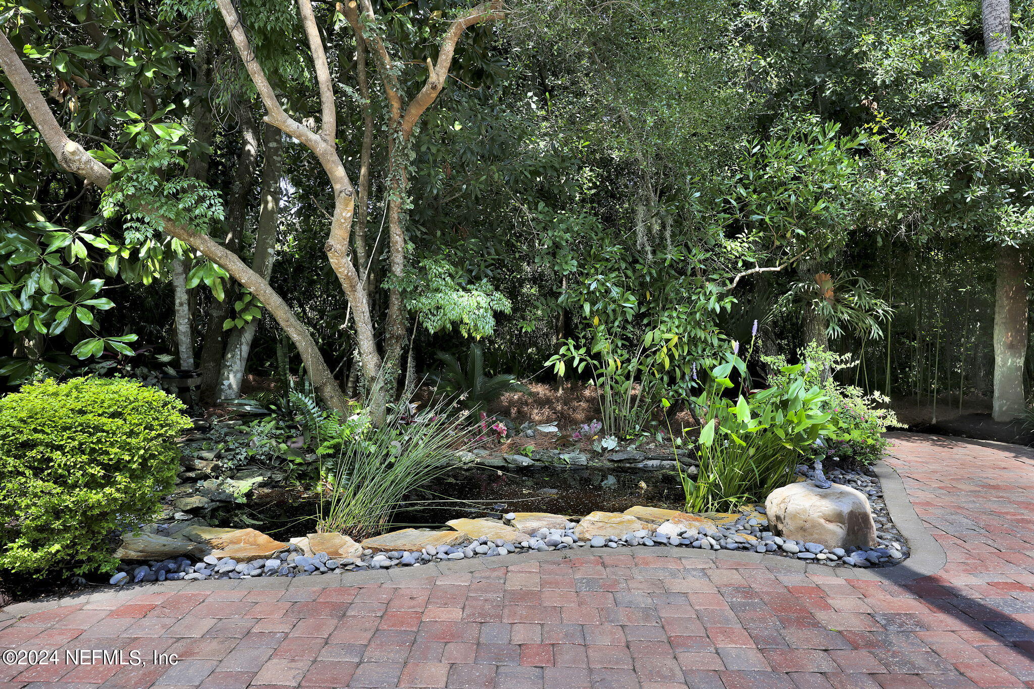 789 Mill Stream Road Ponte Vedra Beach, FL 32082 - Photo 36 of 46 a view of a garden with potted plants