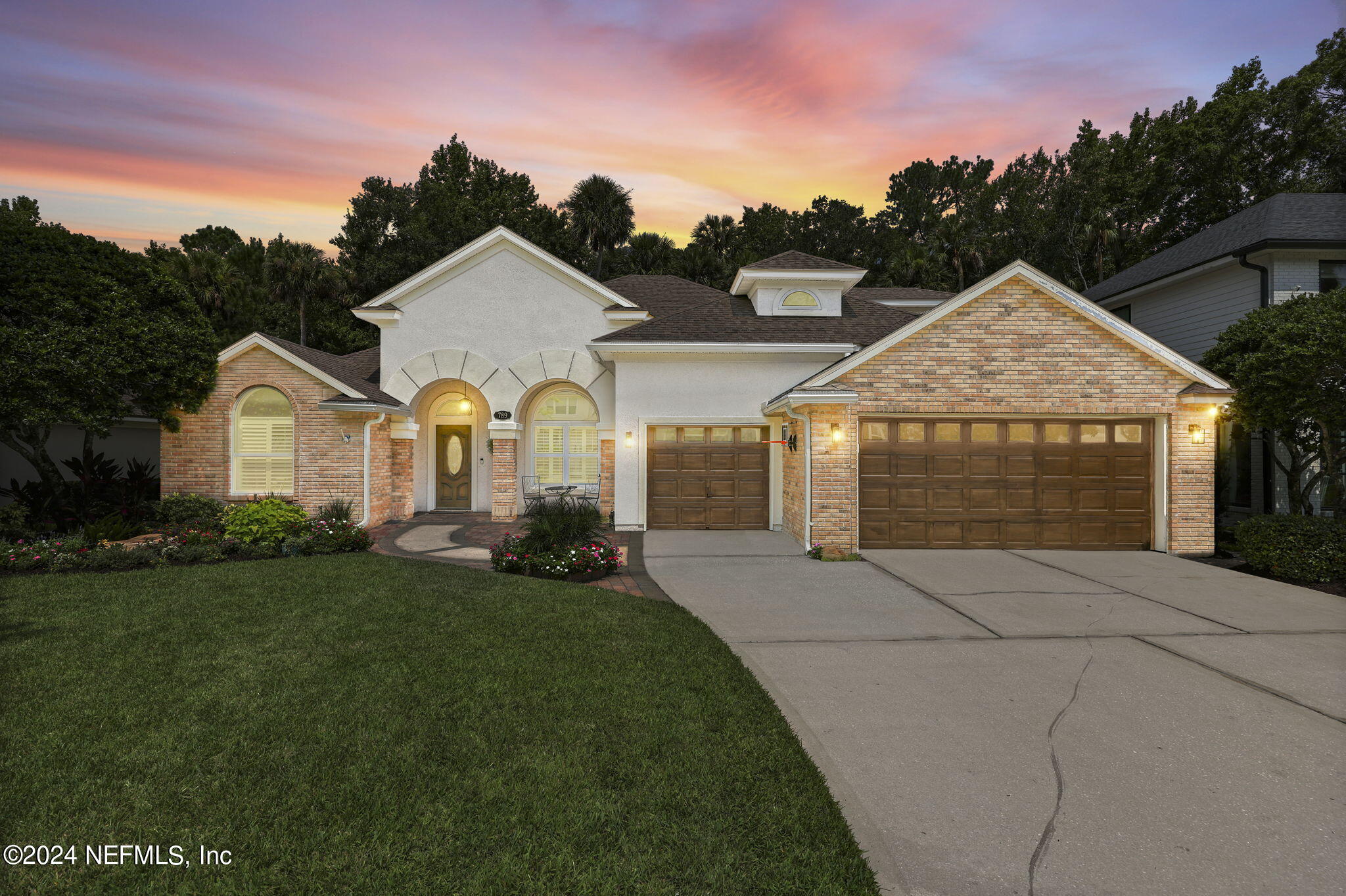 789 Mill Stream Road Ponte Vedra Beach, FL 32082 - Photo 39 of 46 a view of a white house with a yard and potted plants