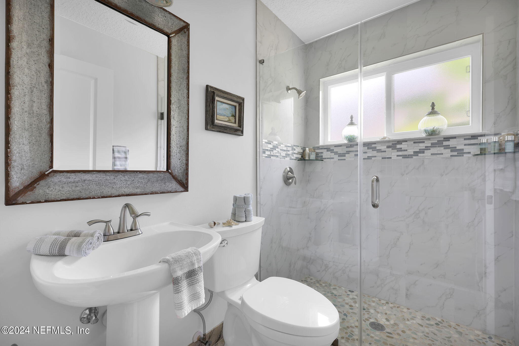 789 Mill Stream Road Ponte Vedra Beach, FL 32082 - Photo 5 of 46 a bathroom with a sink toilet a mirror and shower
