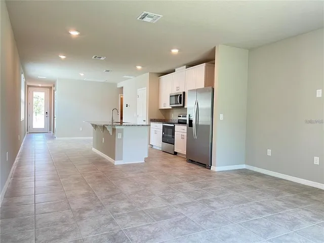 a view of a kitchen with a sink