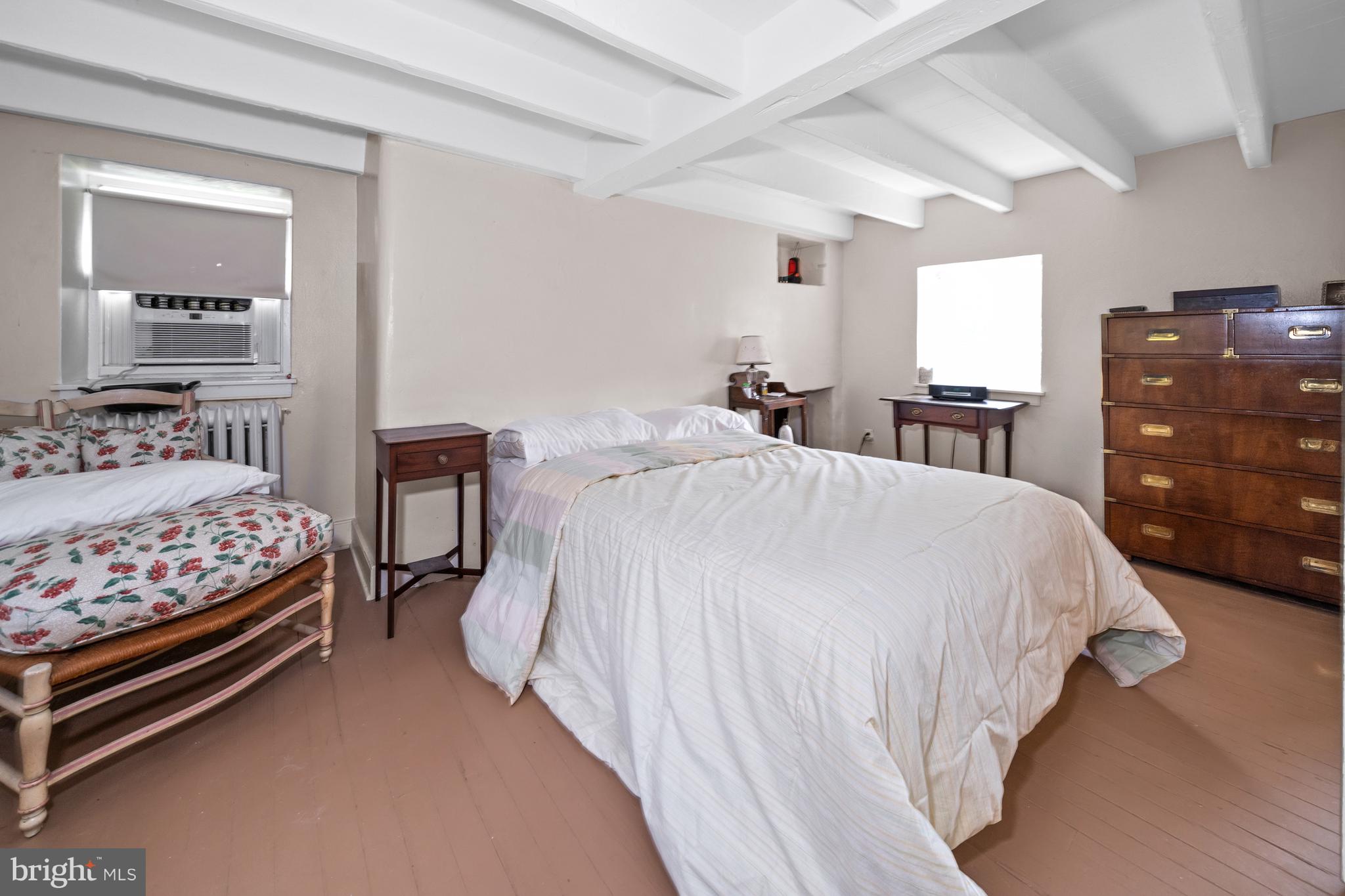 818 B Burrows Run Road Chadds Ford, PA 19317 - Photo 54 of 73 a bedroom with a bed and a dresser
