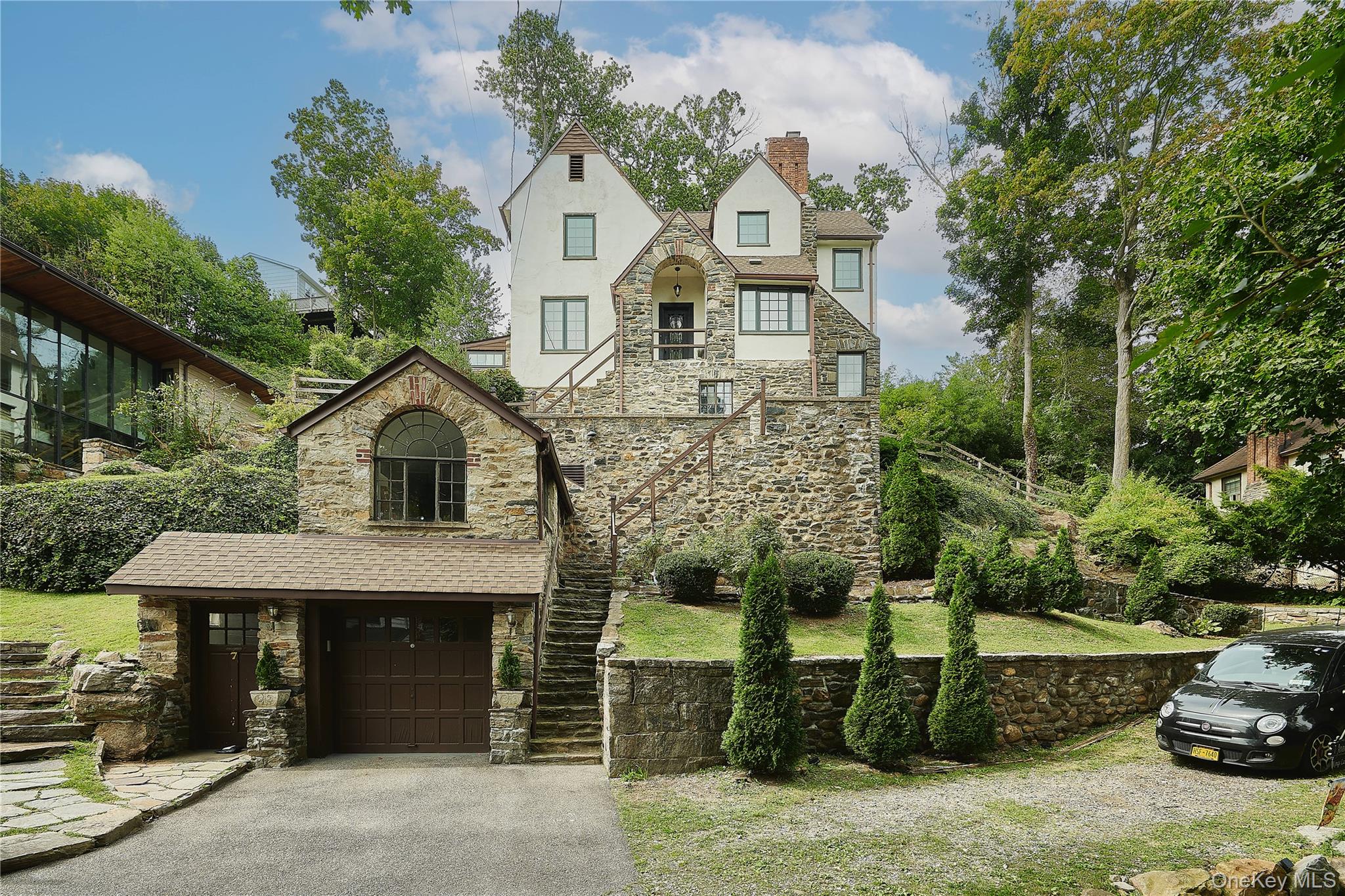 7 Avondale Road Yonkers, NY 10710 - Photo 2 of 36 a front view of a house with a garden