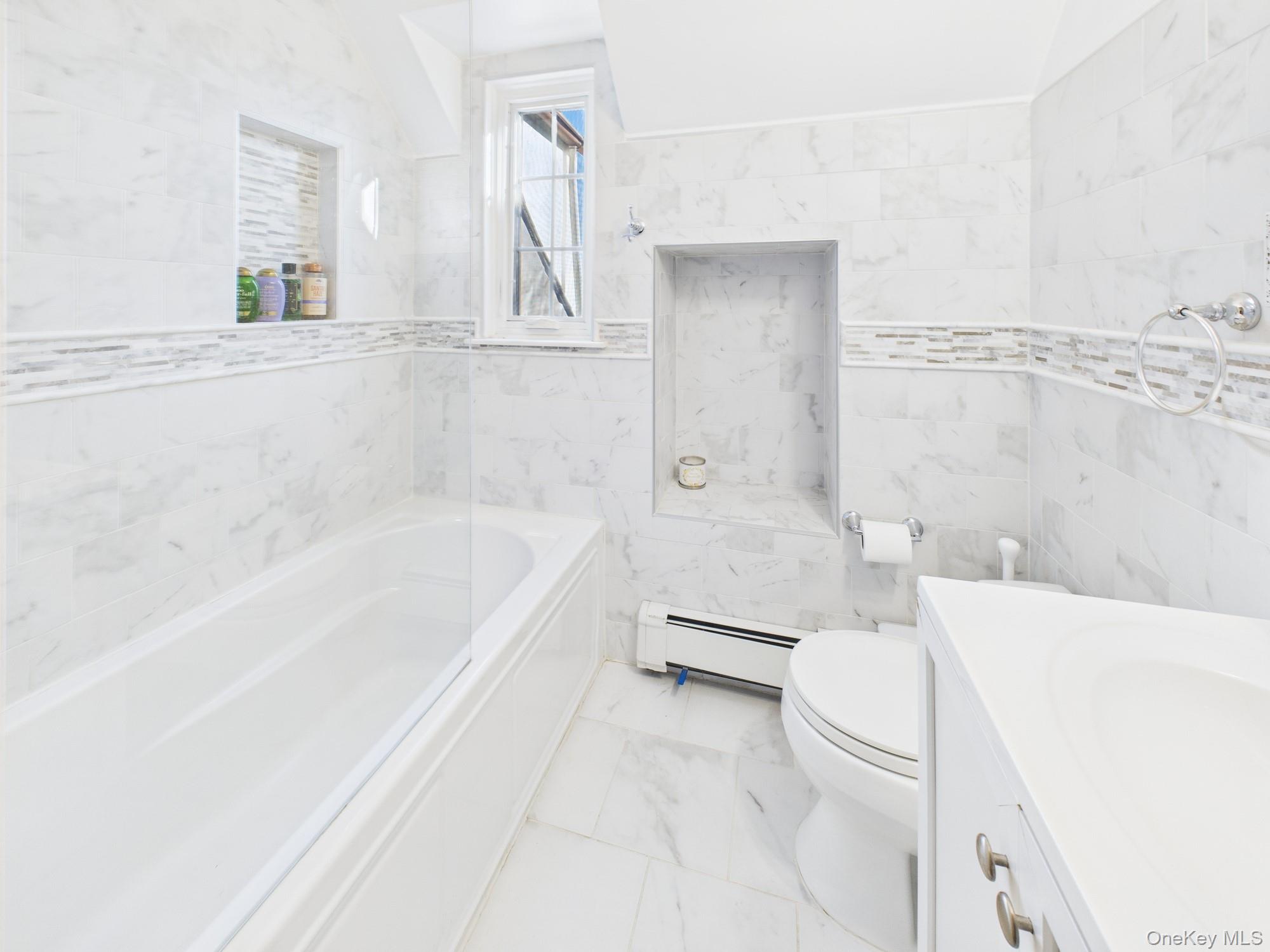 7 Avondale Road Yonkers, NY 10710 - Photo 28 of 36 a bathroom with a bathtub a toilet and a shower