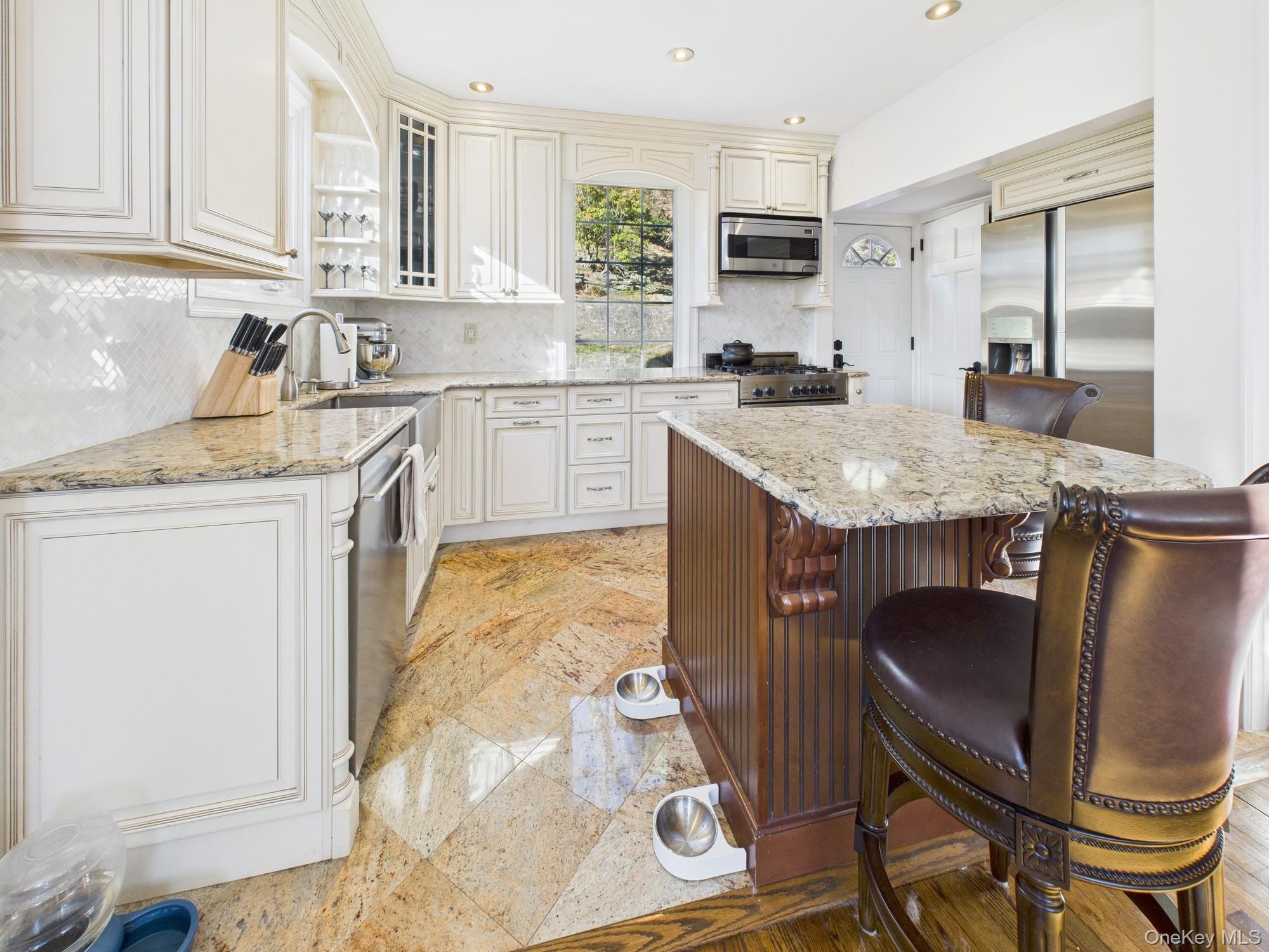 7 Avondale Road Yonkers, NY 10710 - Photo 8 of 36 a kitchen with granite countertop cabinets and chairs