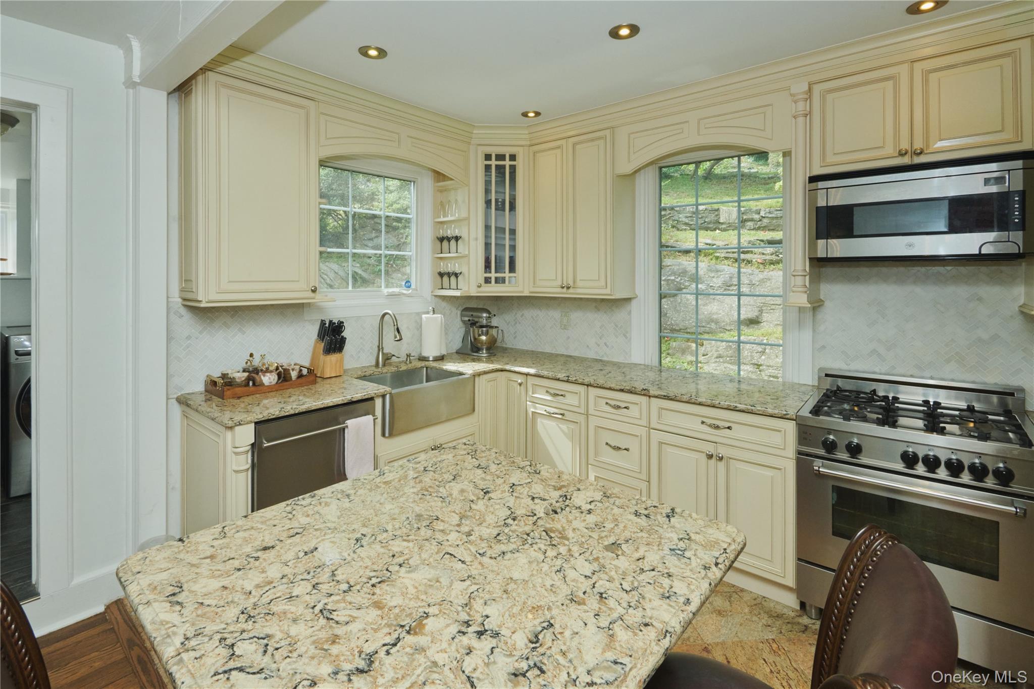 7 Avondale Road Yonkers, NY 10710 - Photo 9 of 36 a kitchen with stainless steel appliances granite countertop a stove a sink and a microwave