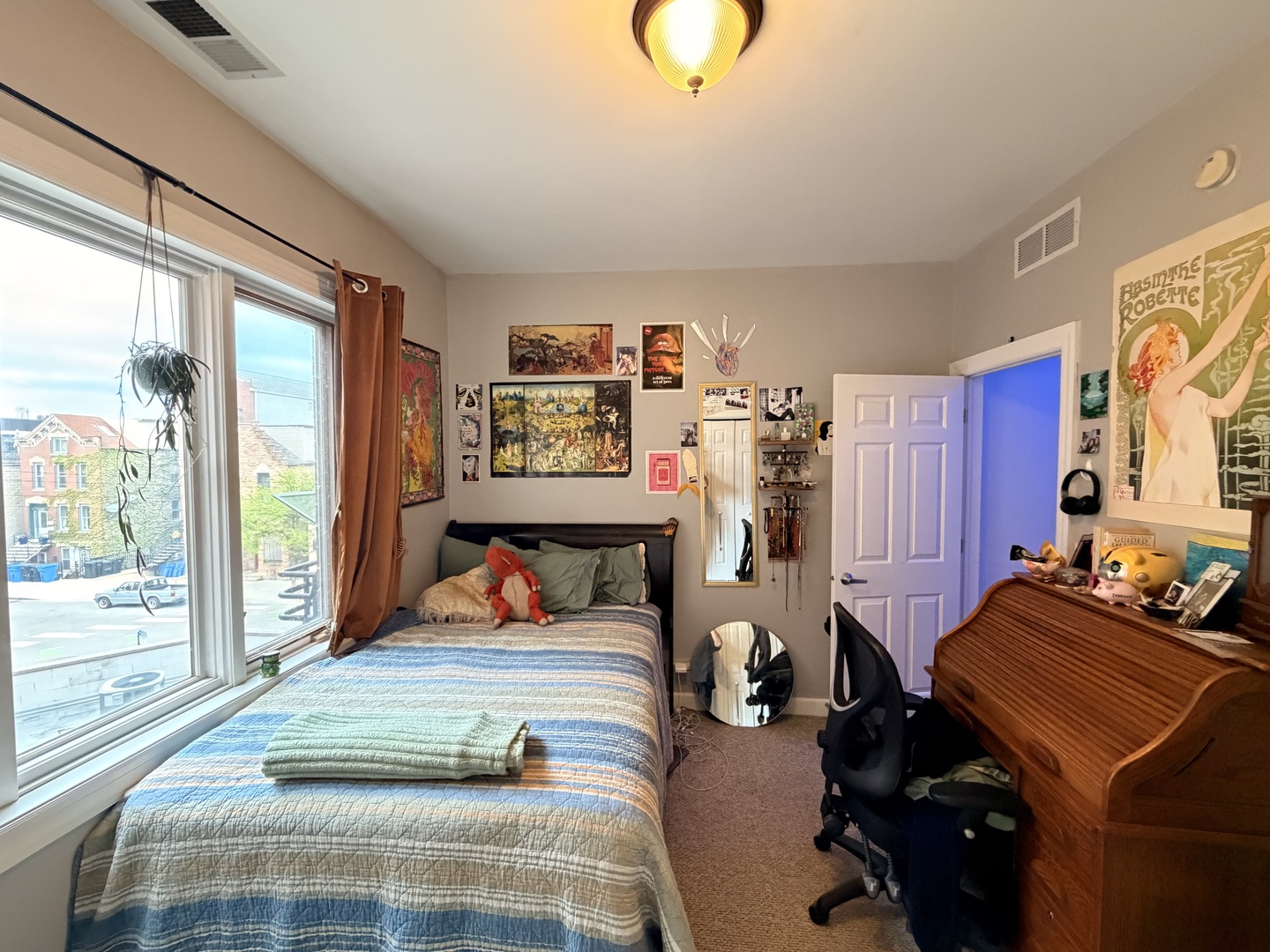 842 North Racine Avenue, Unit 202 Chicago, IL 60642 - Photo 21 of 25 a bedroom with furniture and a large window