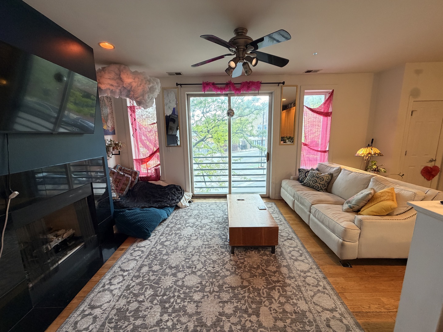 842 North Racine Avenue, Unit 202 Chicago, IL 60642 - Photo 3 of 25 a living room with furniture and a fireplace