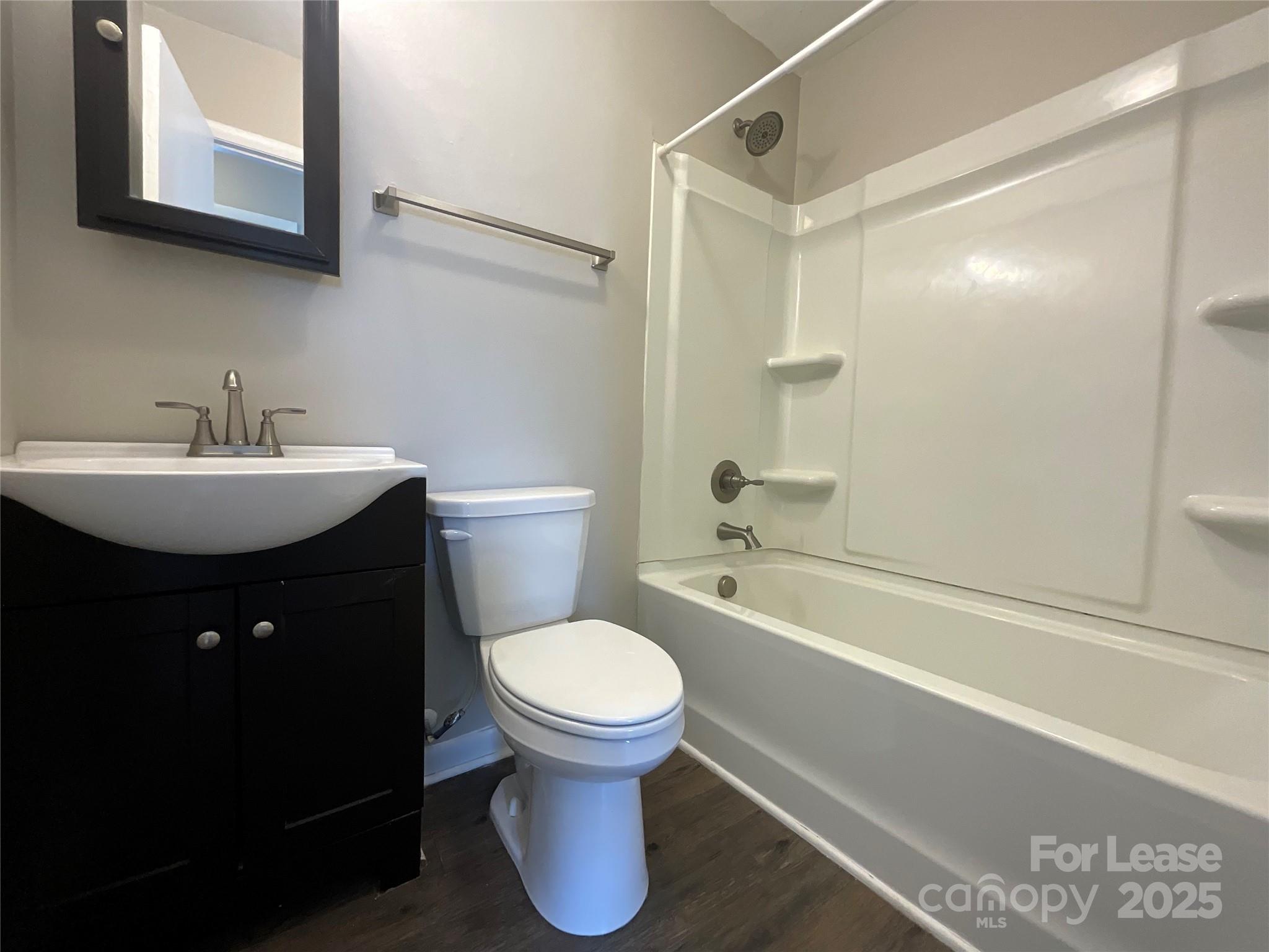 2002 Airport Road, Unit B Salisbury, NC 28147 - Photo 7 of 13 a bathroom with a sink toilet and shower