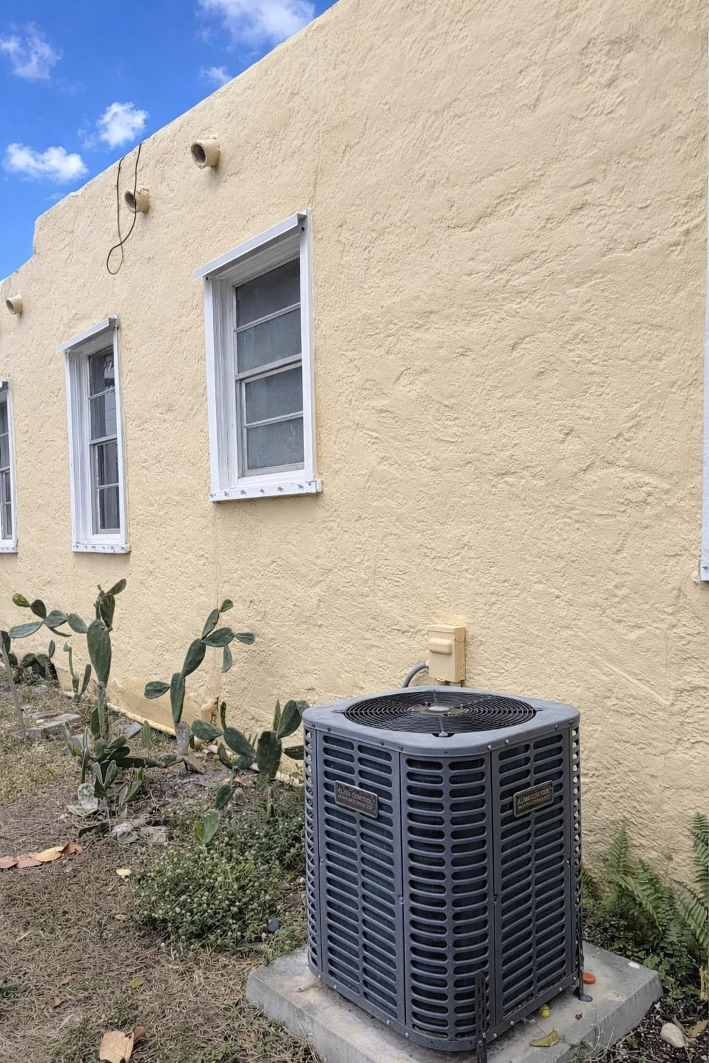 416 Revere Road West Palm Beach, FL 33405 - Photo 3 of 9 a view of a brick house with many windows