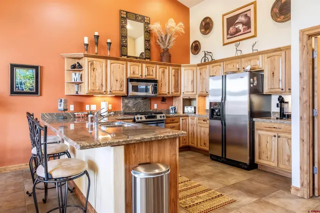 a view of a livingroom with furniture and windows