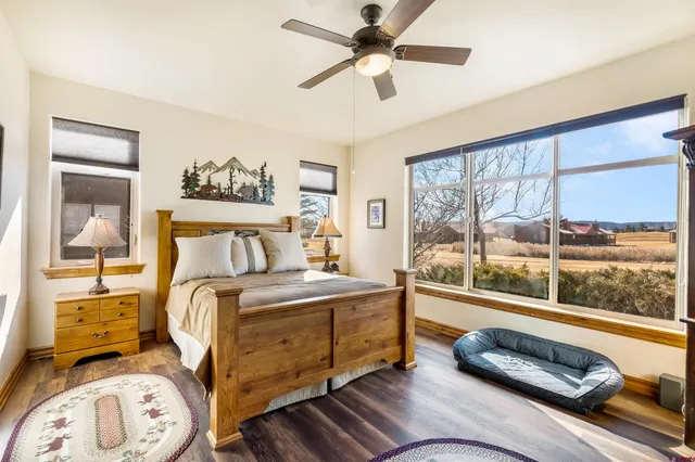 a bedroom with a bed and a desk