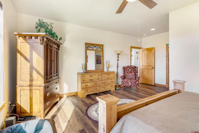 a walk in closet with a glass door and shower