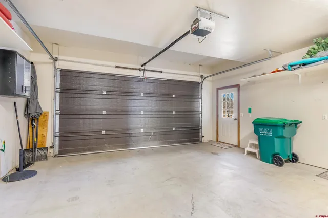 a view of a living room and a floor to ceiling window