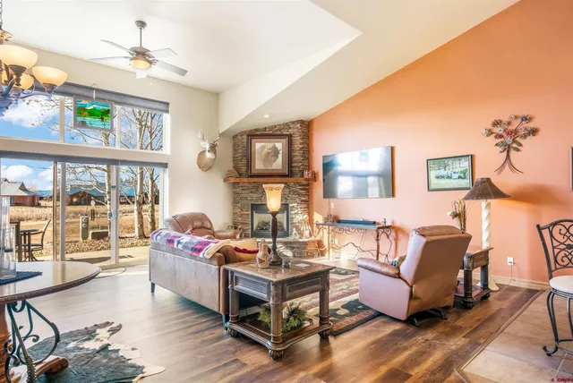 a living room with furniture and a fireplace